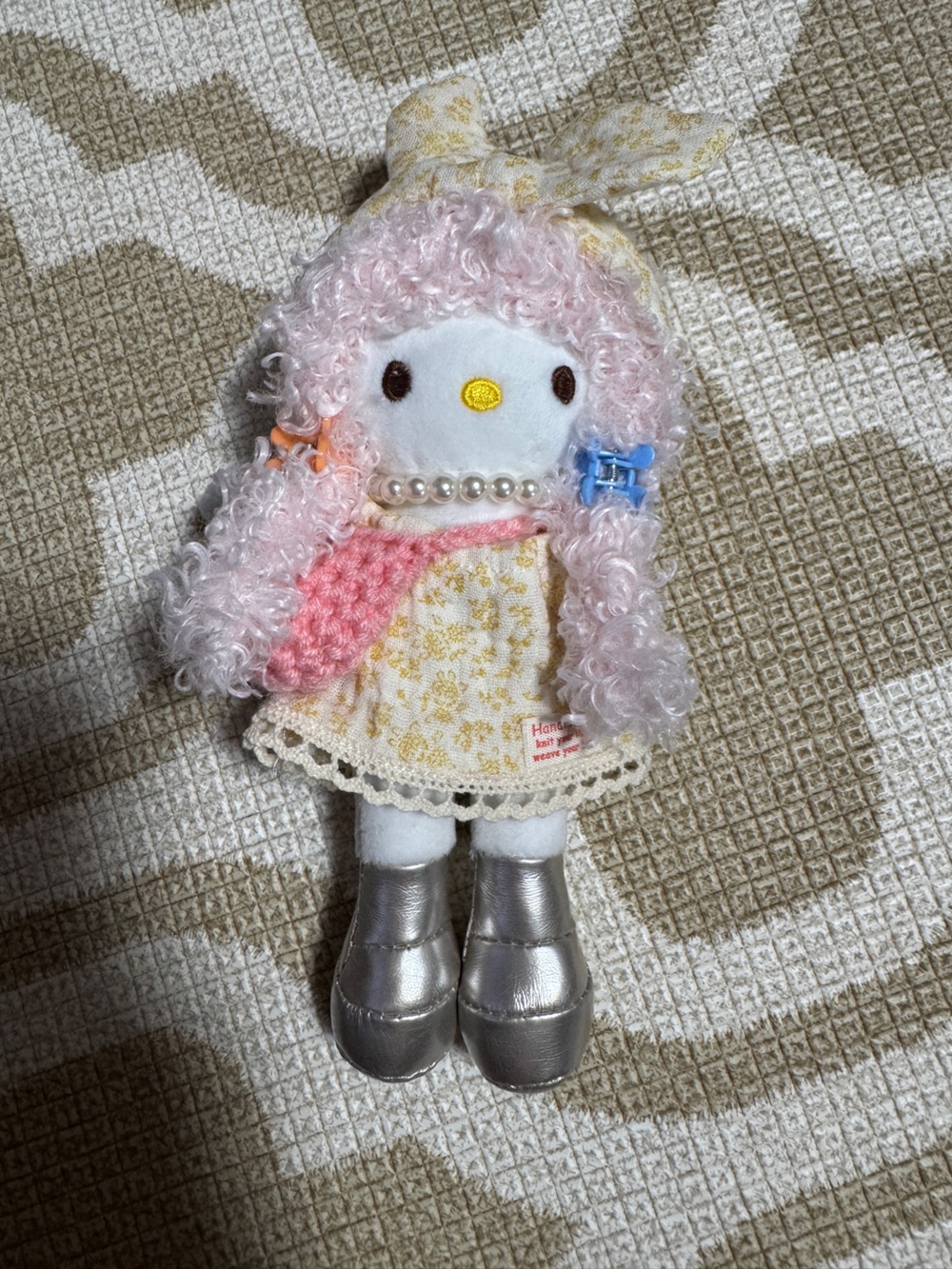 Hello Kitty doll Bag Charm Keychain with pink curly hair, wearing a yellow flora